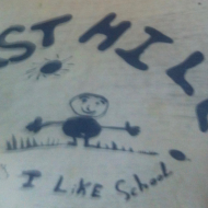 East Hill is why I like school with drawing of smiling child
