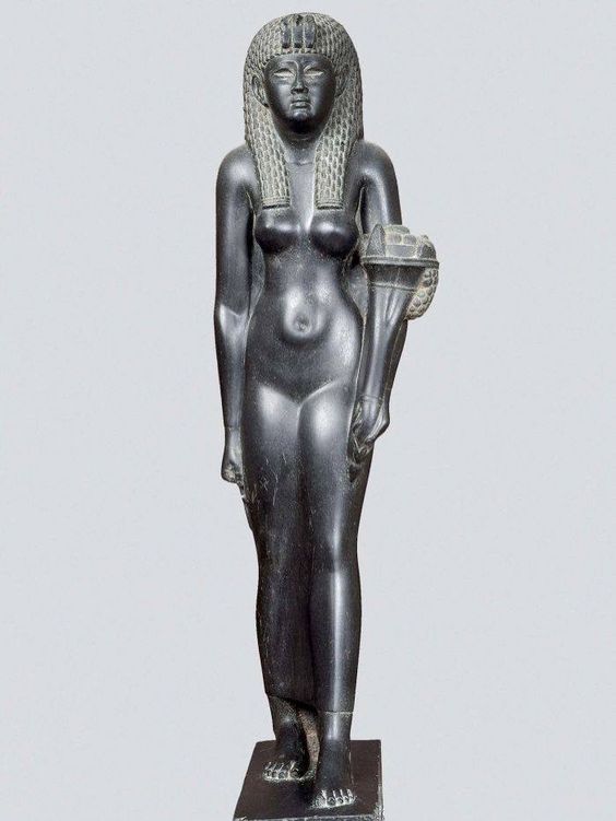 black shiny stone basalt statue of a naked woman in an Egyptian style