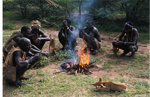 San men around a campfire