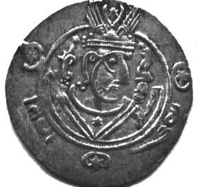 black and white photo of a coin with a man's head on it