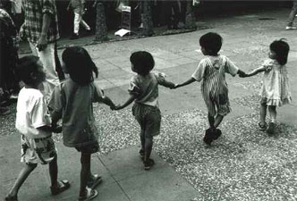 DNA model - a line of children holding hands in a playground