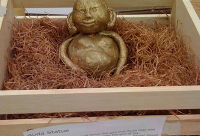 Gold Buddha statue in a box