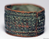 A cylindrical metal thimble-ring