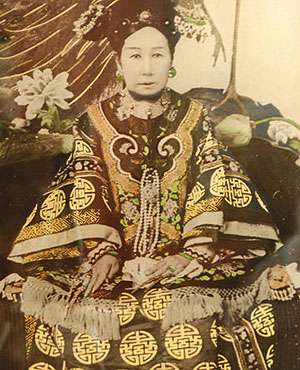 photo of a Chinese woman sitting down in very fancy robes