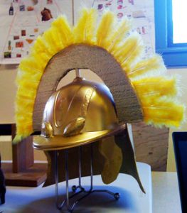 A Roman helmet made from a baseball cap spray painted gold