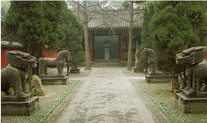 A Chinese walkway, garden, and tomb