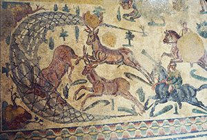 Roman mosaic of men surrounding deer with nets