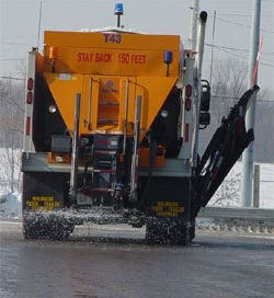 A salt truck spreading salt on the road