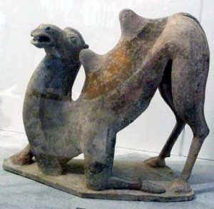 A clay model of a camel kneeling