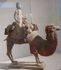 Clay model of a Silk Road trader riding a camel