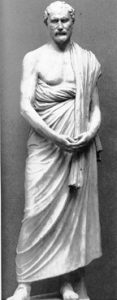 A stone statue of a white man with a beard: Demosthenes