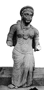 Ancient Indian clothing: A woman wearing a long tunic - Mathura, 100s AD