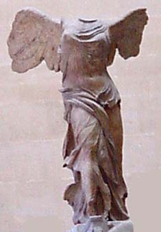 Winged victory: stone statue of woman with wings