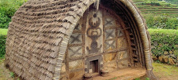 A barrel-vaulted thatched house in rural India today.