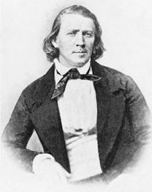 Brigham Young: a young white man in a white shirt and dark jacket