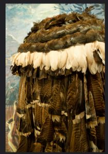 Cherokee feather cloak made of brown and white feathers: Native American clothing history