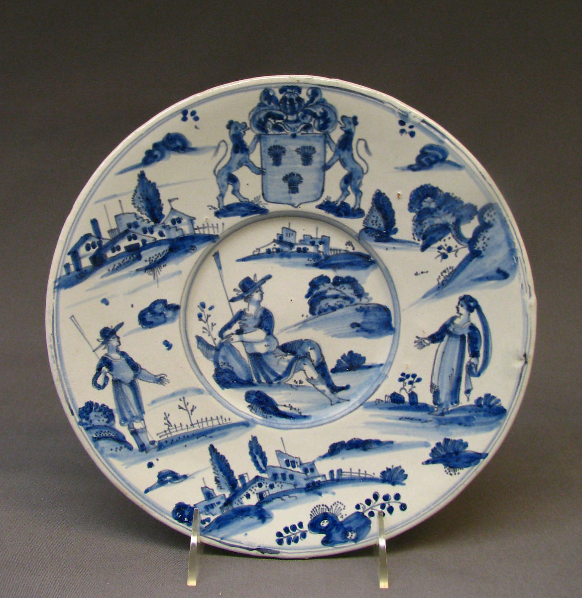 blue and white plate with french scenes