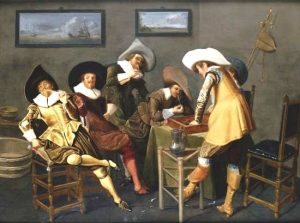 five white men partying with pipes and a backgammon board in a bare room. Fancy hats.