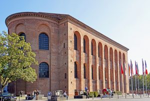 a brick building with arcades and windows ,and a rounded apse