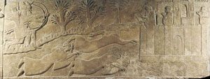 Assyrian soldiers attack a town. Some are swimming, using balloons made of goatskins to hold themselves up. Palace of Ashurnasirpal II, Nimrud, 860 BC. See the walls and buildings of the town?